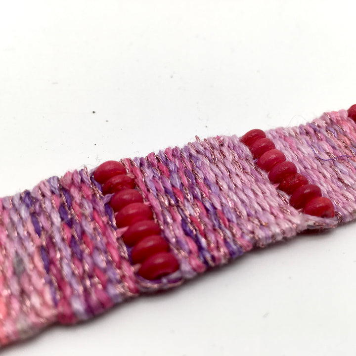 Geweven armband in verschillende roze en lavendel tinten