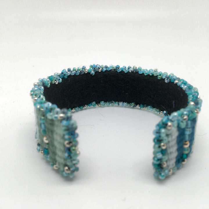 Geweven cuff armband in blauw en groen