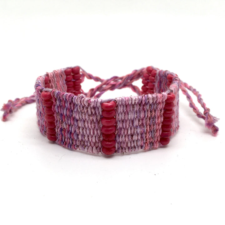 Geweven armband in verschillende roze en lavendel tinten
