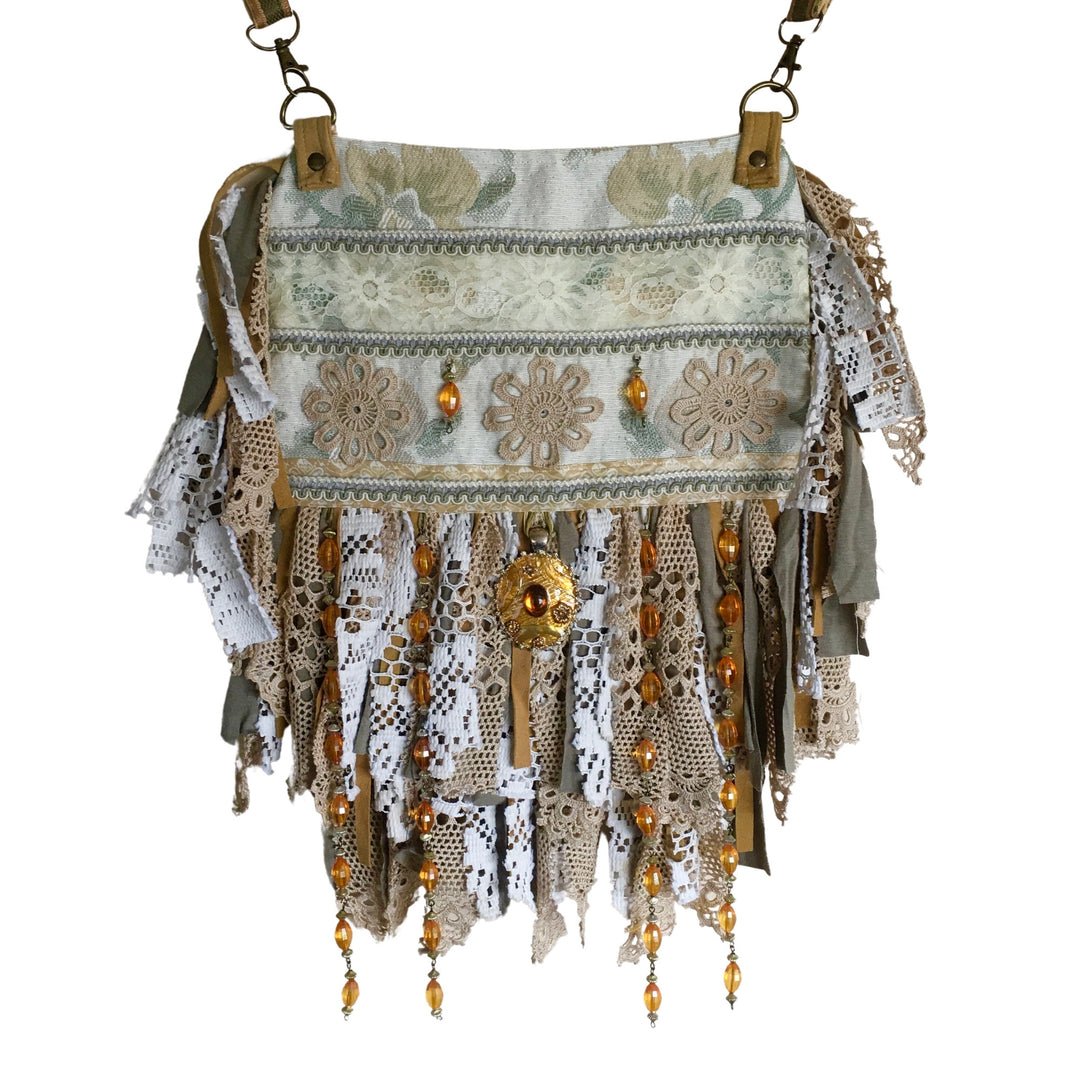 Boho tapestry crossbody bag in soft green and beige with lace, amber beads, and vintage-style crochet fringe