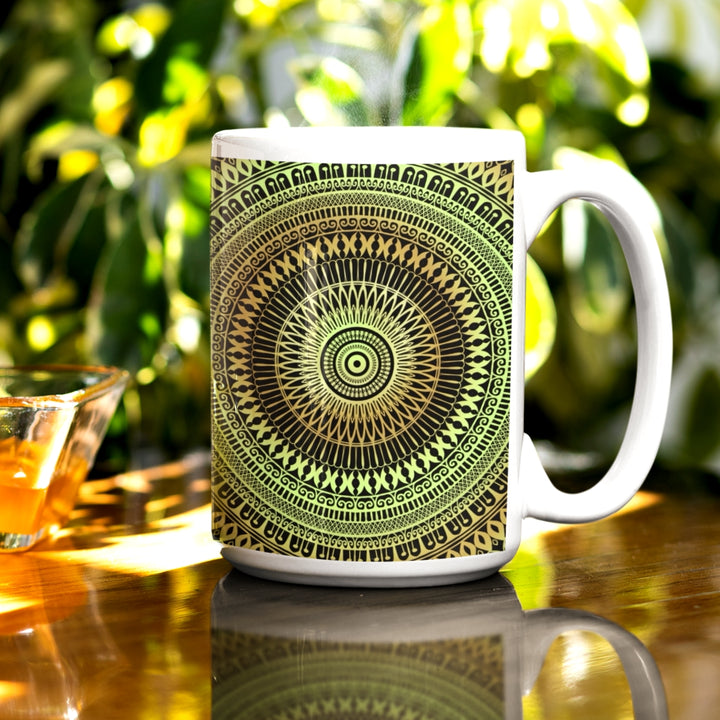 A mandala mug in soft green and oker, featuring intricate design that introduces natural beauty and tranquility to the visual experience.