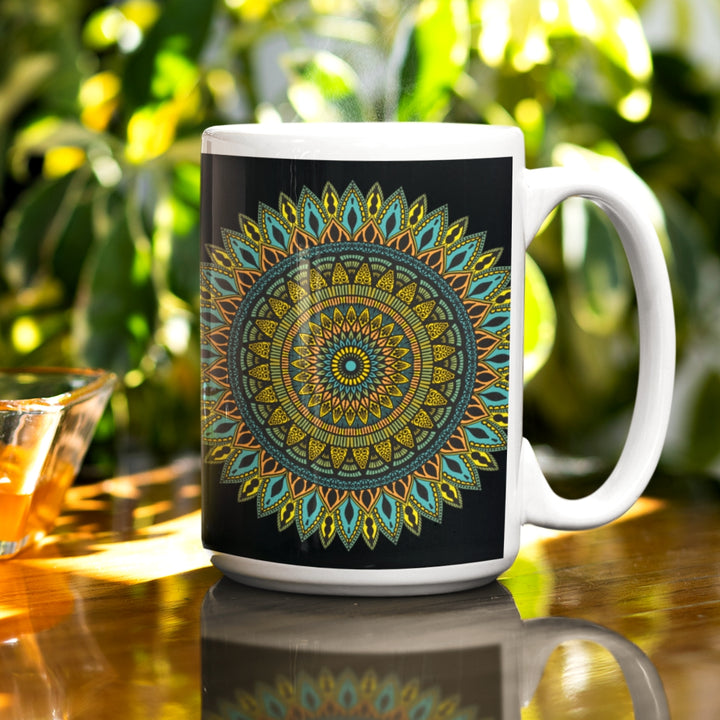 A black mug adorned with an intricate mandala design, combining elegance and mystique for a captivating visual experience