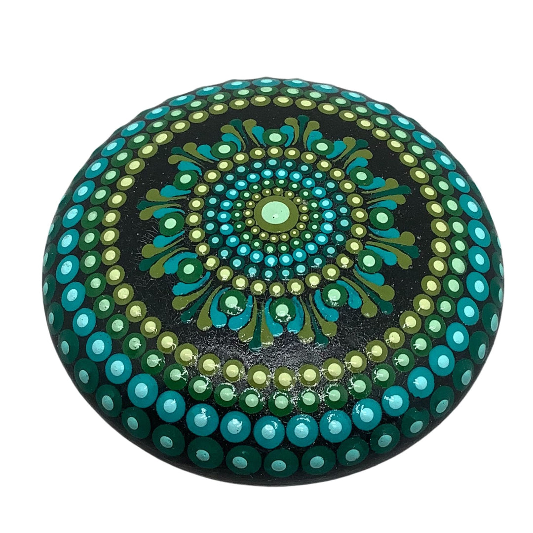 Hand-painted mandala stone in green and blue with glossy finish, perfect for meditation, gratitude practice, or boho home décor.