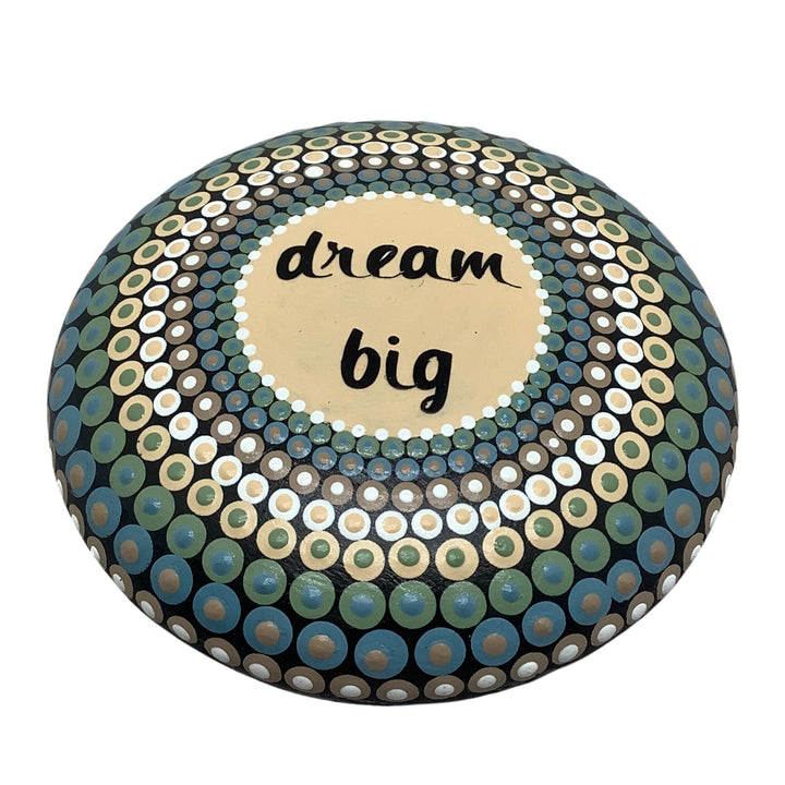 Hand painted mandala stone in soft colors with “Dream Big” text and dot art design