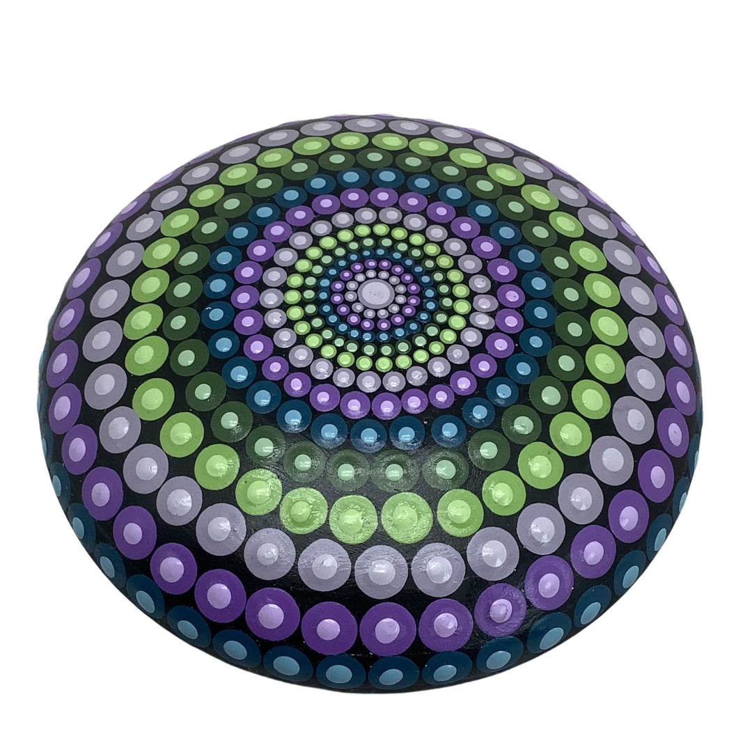 Hand-painted mandala stone in purple, green, and blue hues with intricate dot art design.