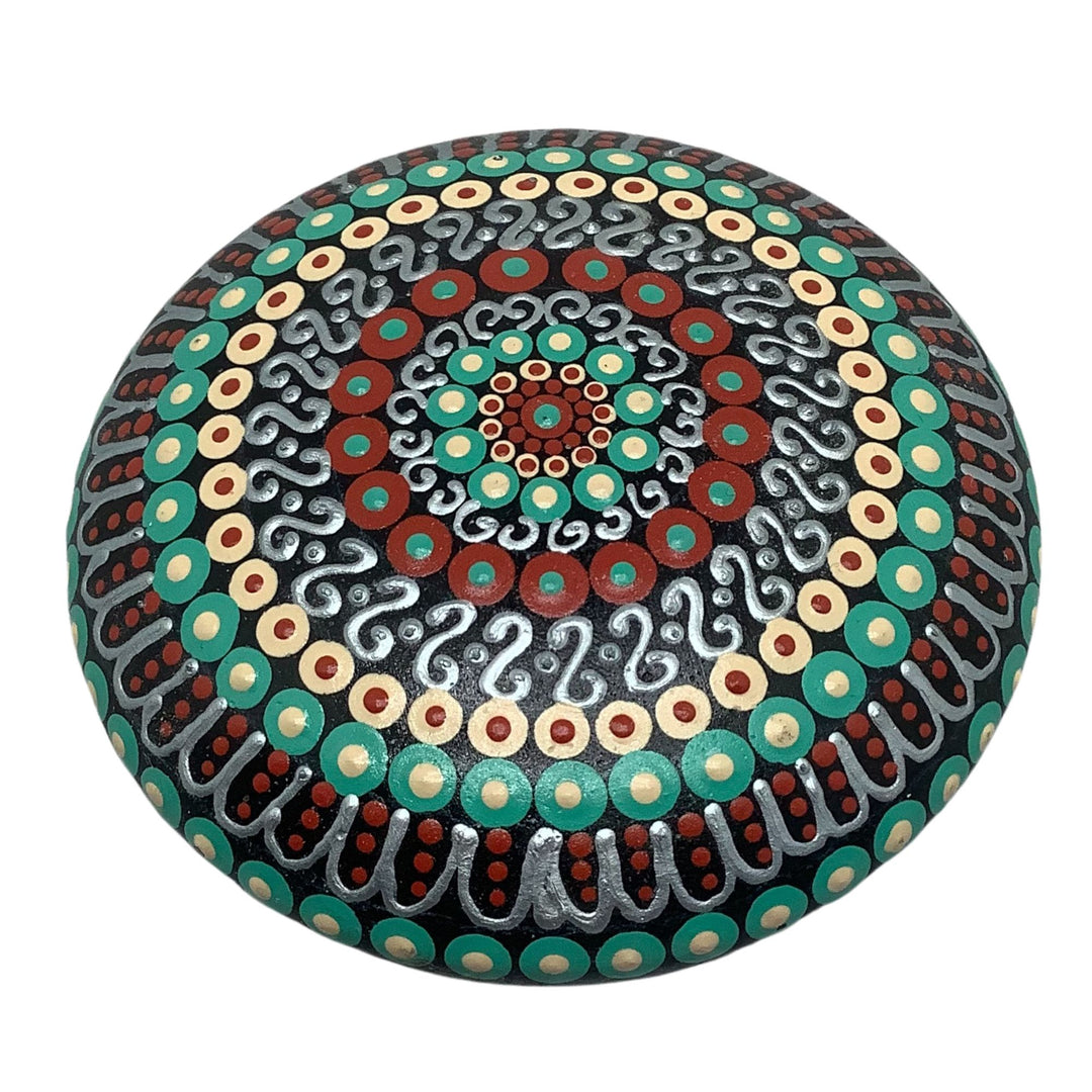 Hand painted mandala stone in deep tones of red, green and silver with intricate dot and swirl patterns