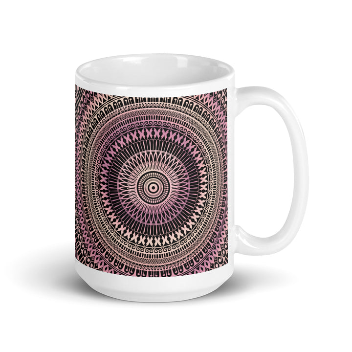 A playful mandala mug in light pink and beige.