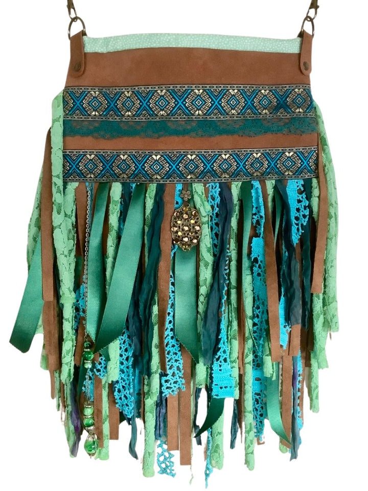 Upcycled leather crossbody bag with turquoise fringe, lace and ribbon – handmade boho design with adjustable strap
