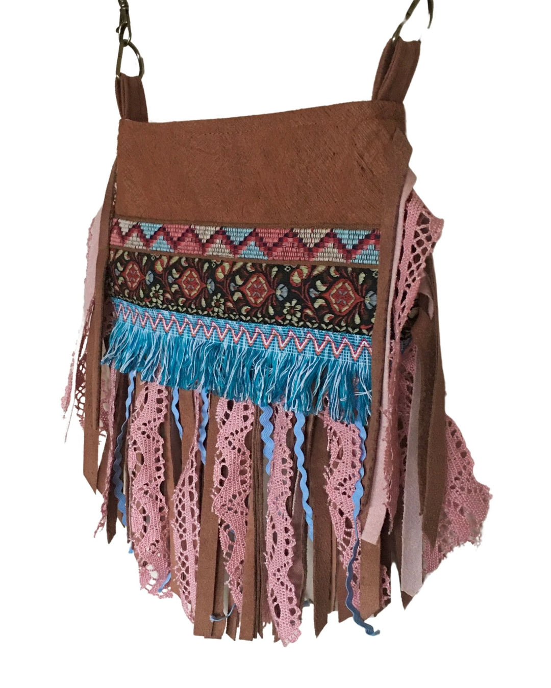 Brown bag with colorful fringe and patterns on a white background