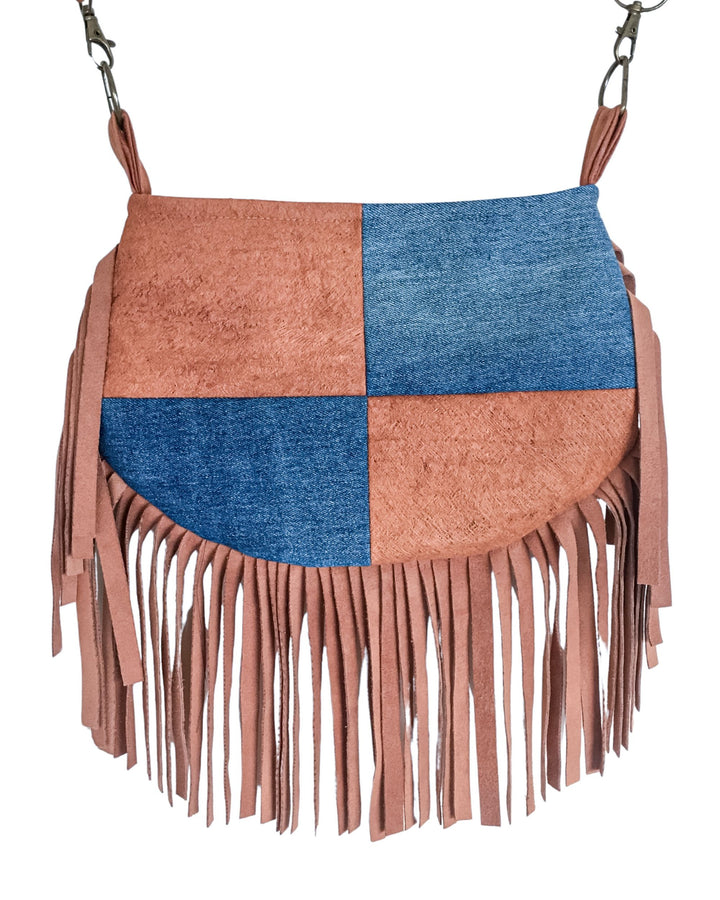 Brown and blue patchwork handbag with fringes on a white background