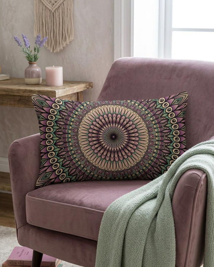 Decorative pillow with mandala pattern on a purple armchair in a cozy living room.
