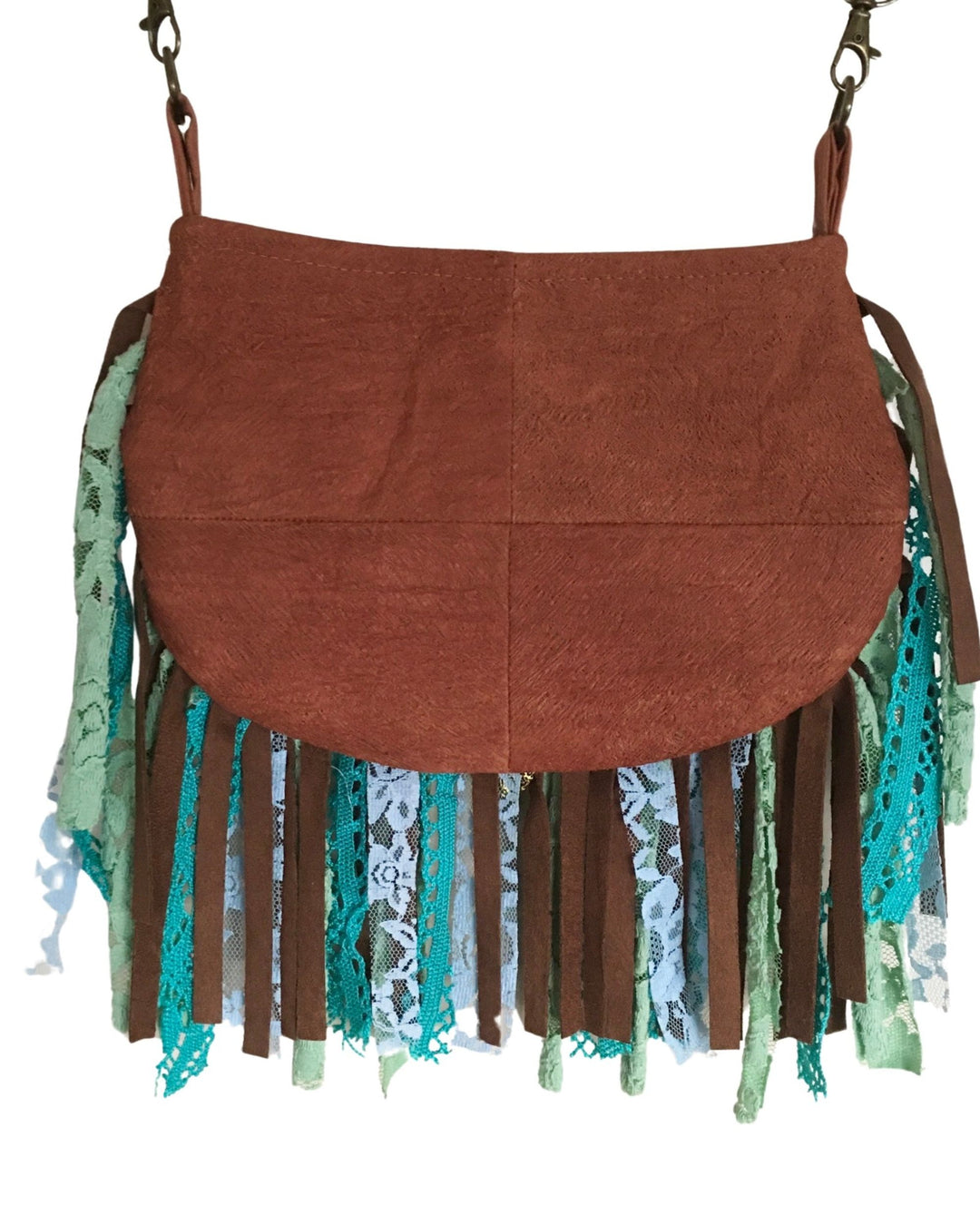 Brown barkcloth handbag with green and blue fringe on a white background