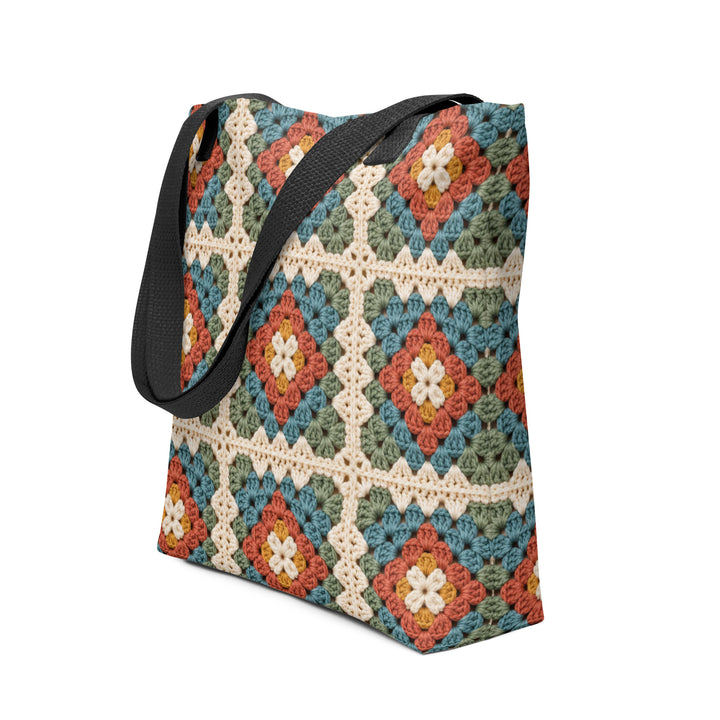 Granny square print tote bag with black handles showing the colorful retro boho pattern