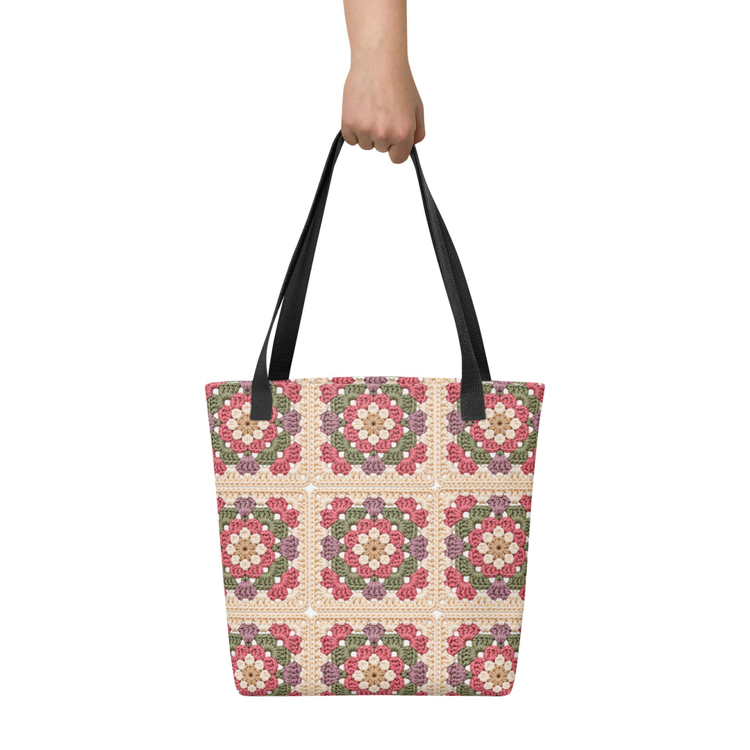Front view of floral granny square printed tote bag with black cotton handles