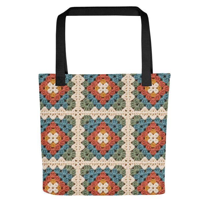 Printed granny square tote bag with black handles on a white background