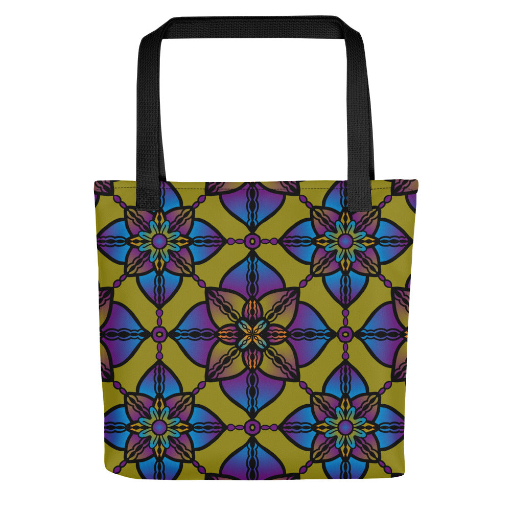 A tote bag featuring a vibrant mandala design with a geometric pattern in purple, blue, and yellow colors.
