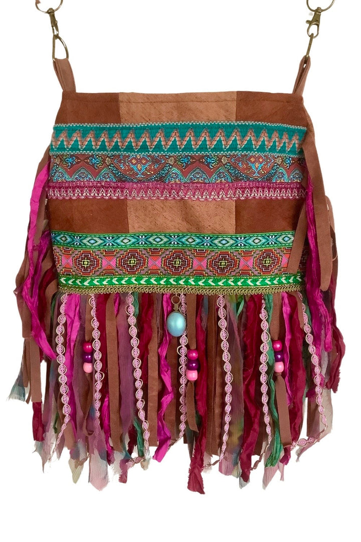 Handmade boho crossbody bag with bark cloth, pink and green fringe, ribbons, and beads