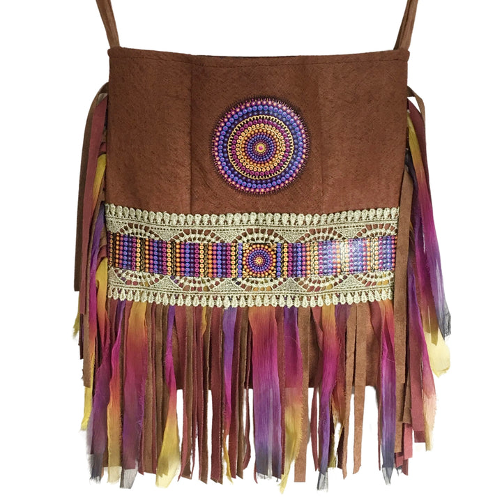 Handmade boho crossbody bag crafted from barkcloth with a hand-painted mandala, colorful silk fringe, and lace ribbon.