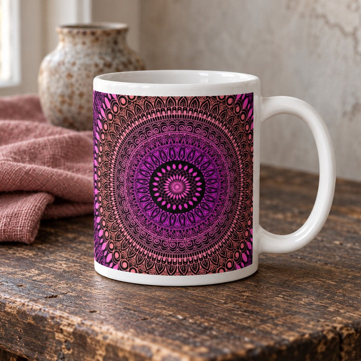 Pink mug with salmon Mehndi mandala design close-up lifestyle photo on a rustic wooden table