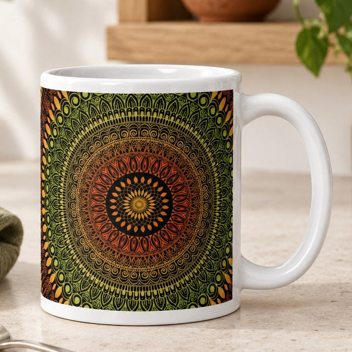 Close-up lifestyle photo of white ceramic mug with terracotta and green mehndi mandala.
