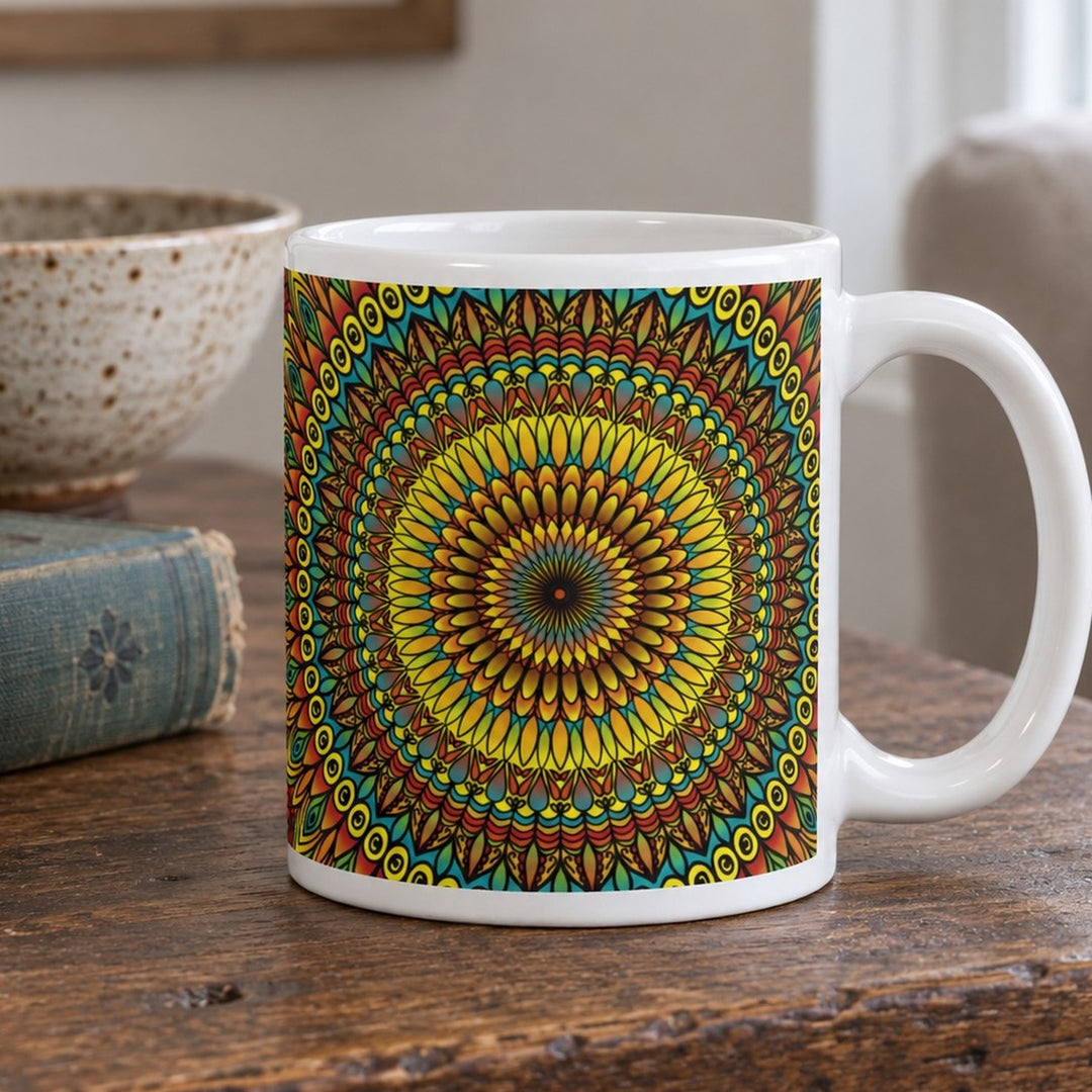 Yellow mug with rust and blue mandala design close-up lifestyle photo on a rustic wooden table