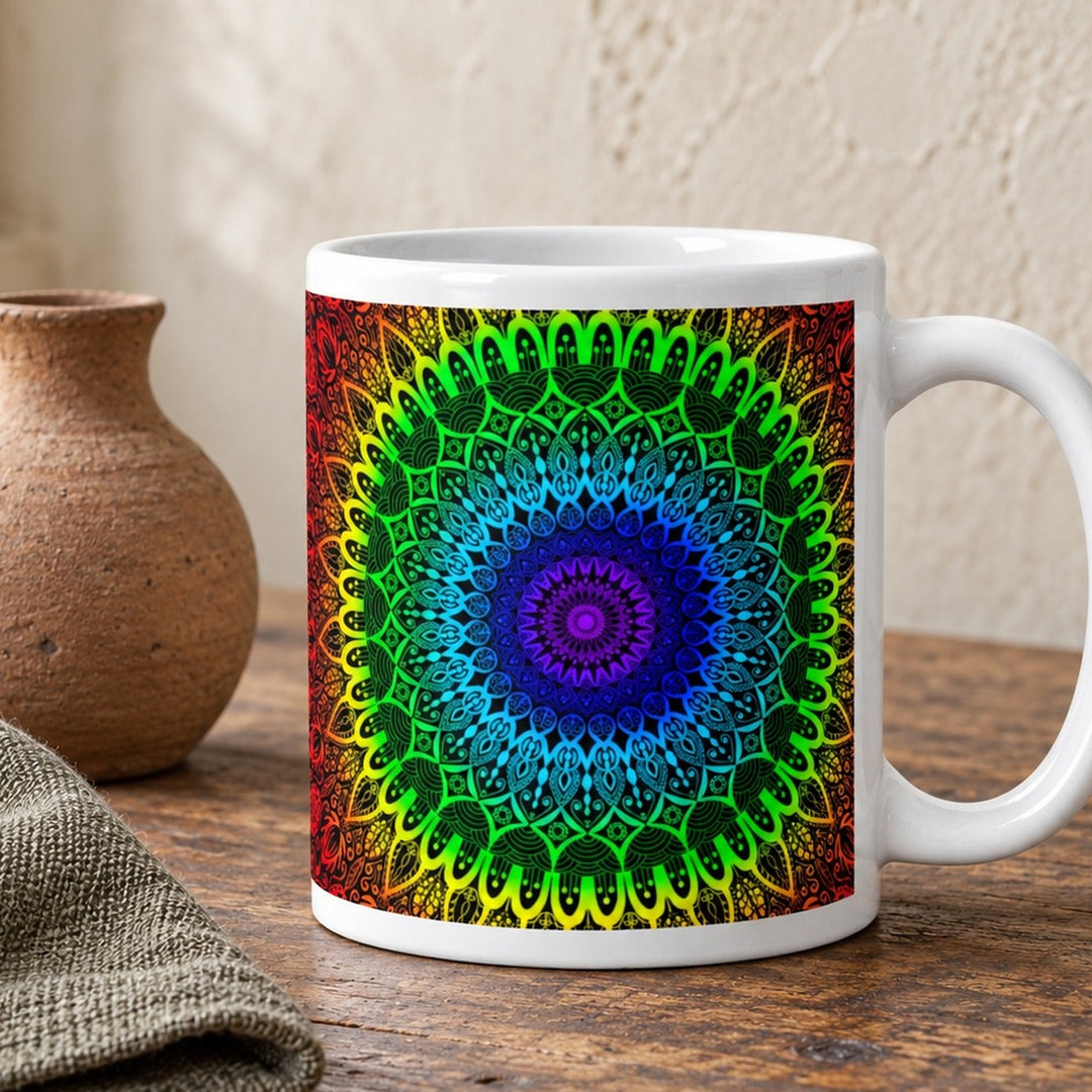 Chakra mug with seven color mandala design close-up lifestyle photo on a rustic wooden table