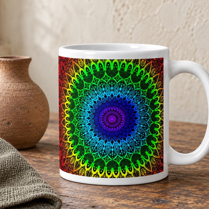 Chakra mug with seven color mandala design close-up lifestyle photo on a rustic wooden table