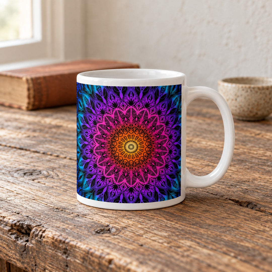 Colorful mug with orange pink purple and blue mandala 11 oz lifestyle photo on a rustic wooden table