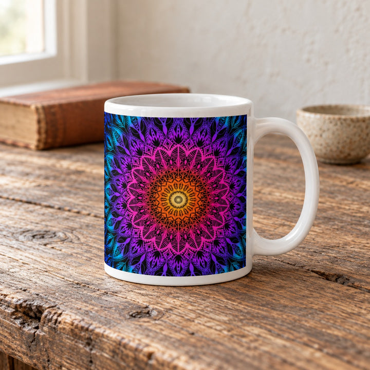 Colorful mug with orange pink purple and blue mandala 11 oz lifestyle photo on a rustic wooden table