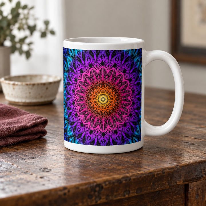 Colorful mug with orange pink purple and blue mandala 15 oz lifestyle photo on a rustic wooden table