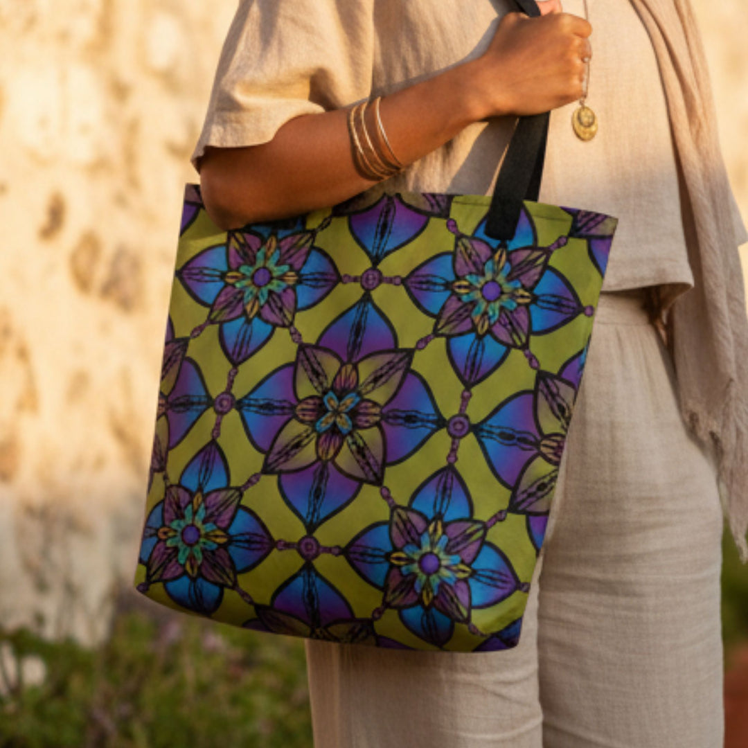 close up of colorful boho mandala tote bag with geometric floral pattern in vibrant blue green and purple tones