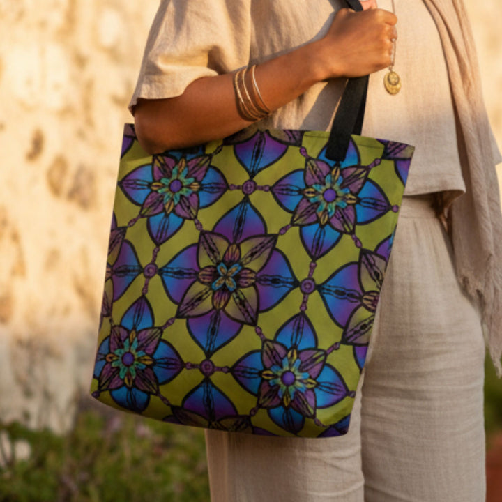 close up of colorful boho mandala tote bag with geometric floral pattern in vibrant blue green and purple tones