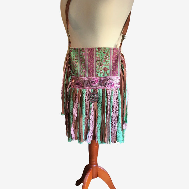 Bohemian-style skirt with fringe and pattern on a mannequin against a white background