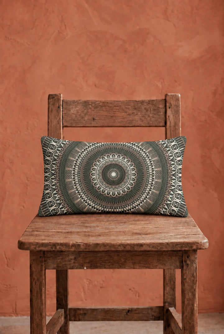 Boho lumbar pillow 12x20 inch with green mandala design on rustic wooden chair, warm terracotta wall, matte linen look fabric, natural woven texture, soft daylight interior