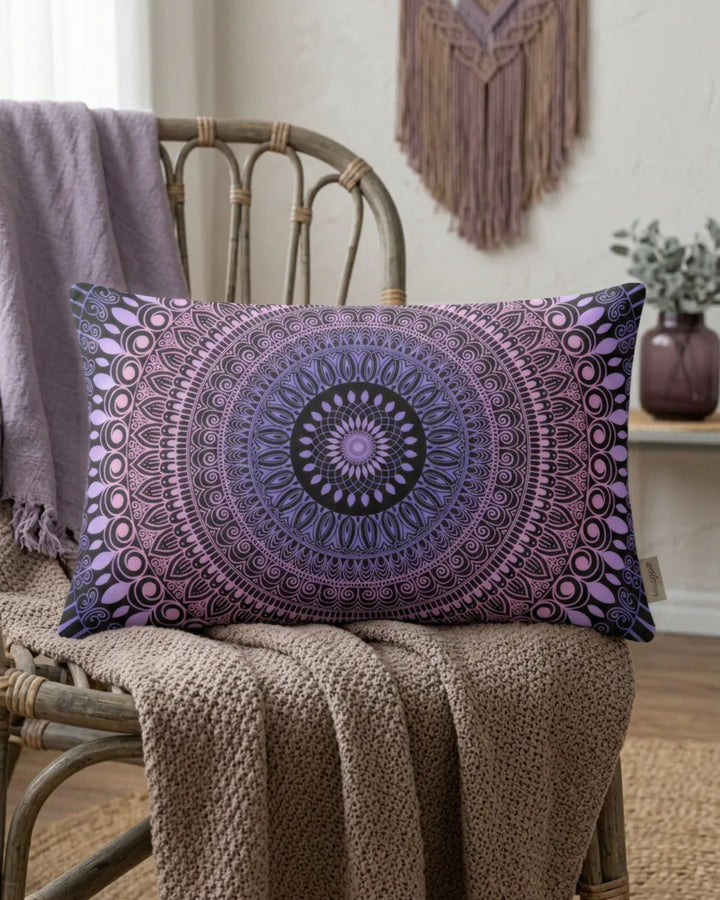 Boho lumbar pillow cover with purple mandala pattern styled on a rattan chair in a cozy boho interior