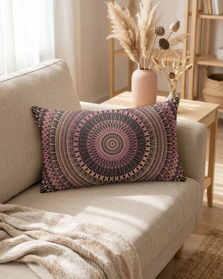 mandala lumbar pillow in blush pink and black tones on beige linen sofa in warm bohemian interior with pampas grass and soft natural lighting