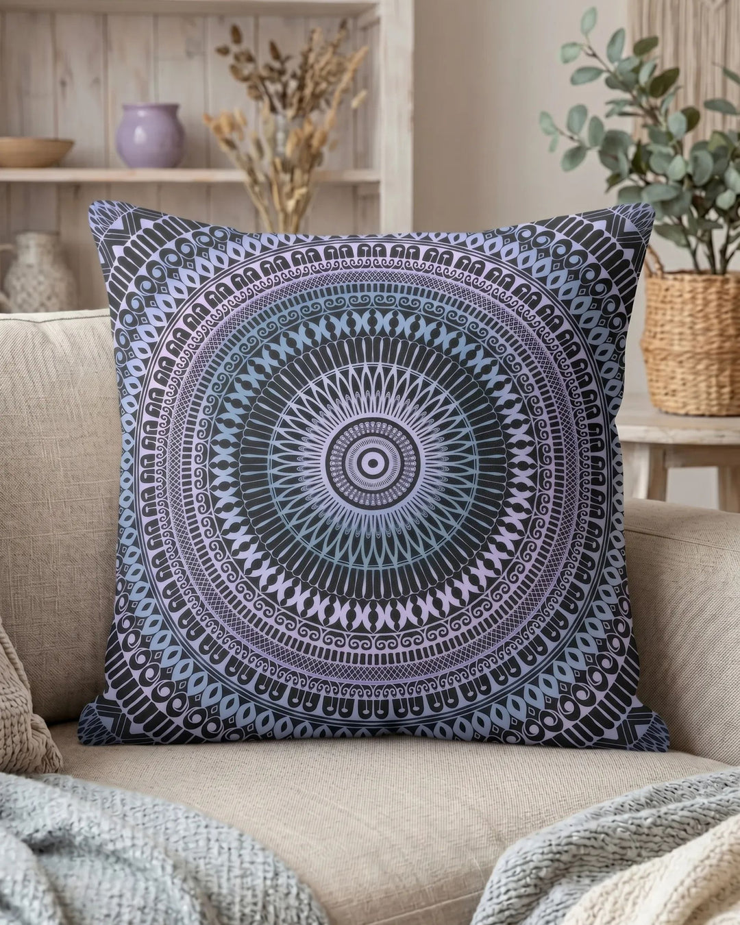bohemian square throw pillow with blue mandala pattern on beige linen sofa, styled living room with light wood shelf, ceramic decor and soft natural lighting