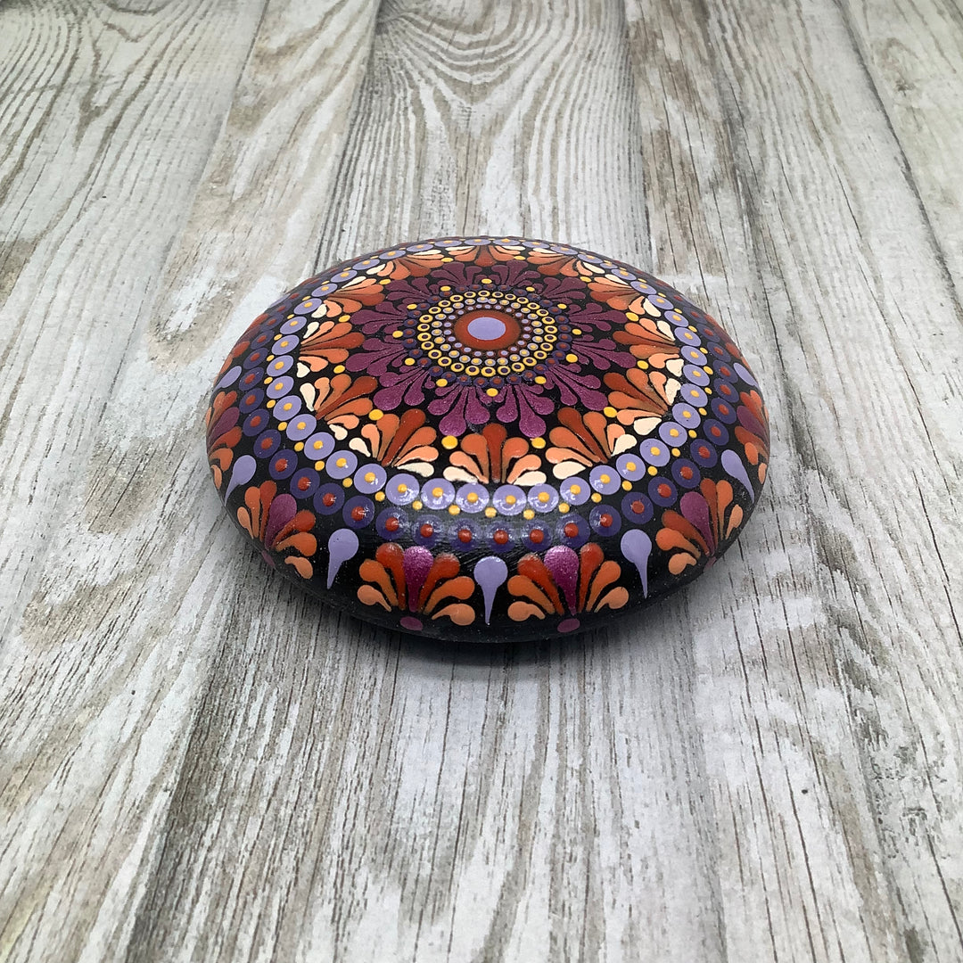 hand painted mandala stone in pink orange and lavender small