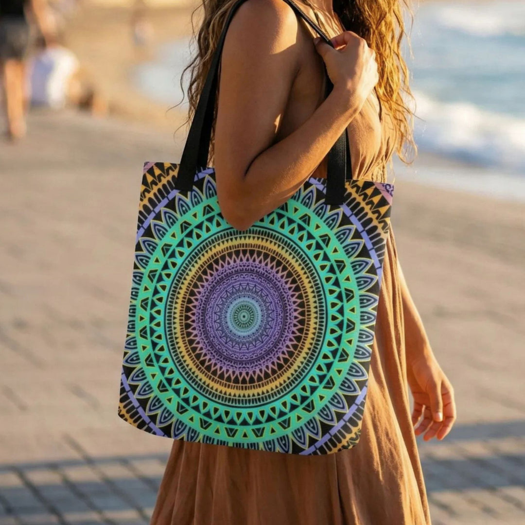 Close-up of bohemian tote bag with vibrant mandala pattern showing fabric detail and craftsmanship in warm sunlight