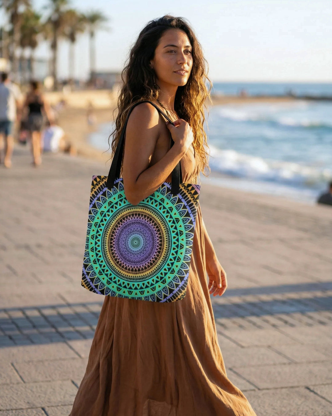 Bohemian tote bag with colorful mandala design worn by woman on sunny beach promenade natural warm lifestyle