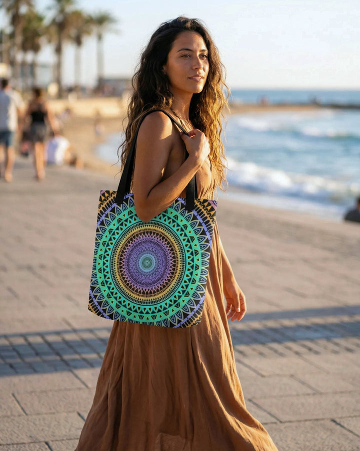 Bohemian tote bag with colorful mandala design worn by woman on sunny beach promenade natural warm lifestyle