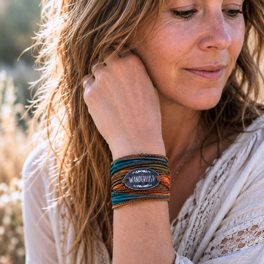 Authentic boho woman wearing a handmade silk wrap bracelet in warm natural sunlight, reflecting the free spirited and creative lifestyle of Boho for Life.