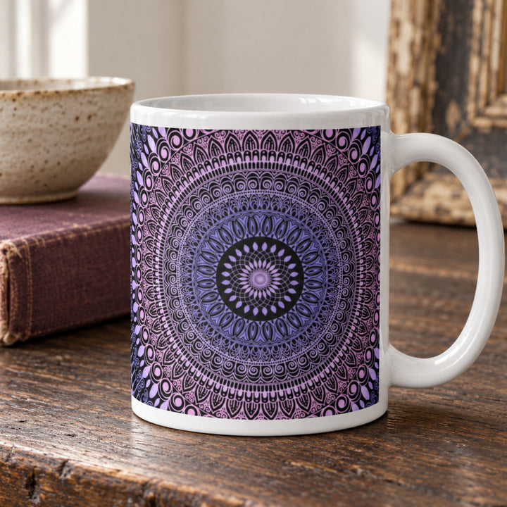 Pink and lavender mandala mug close-up on a rustic wooden table