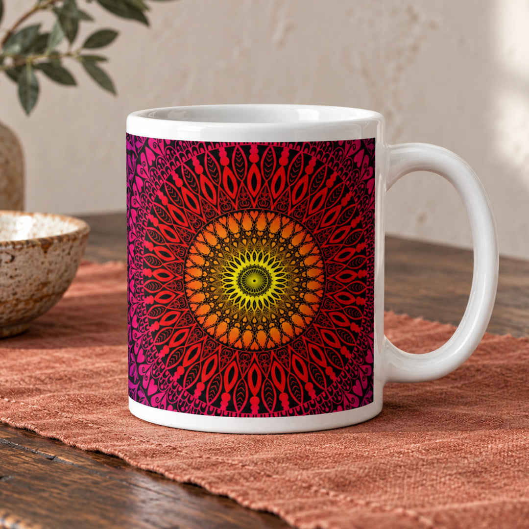 Sunset mug with warm mandala design close-up on a rustic wooden table