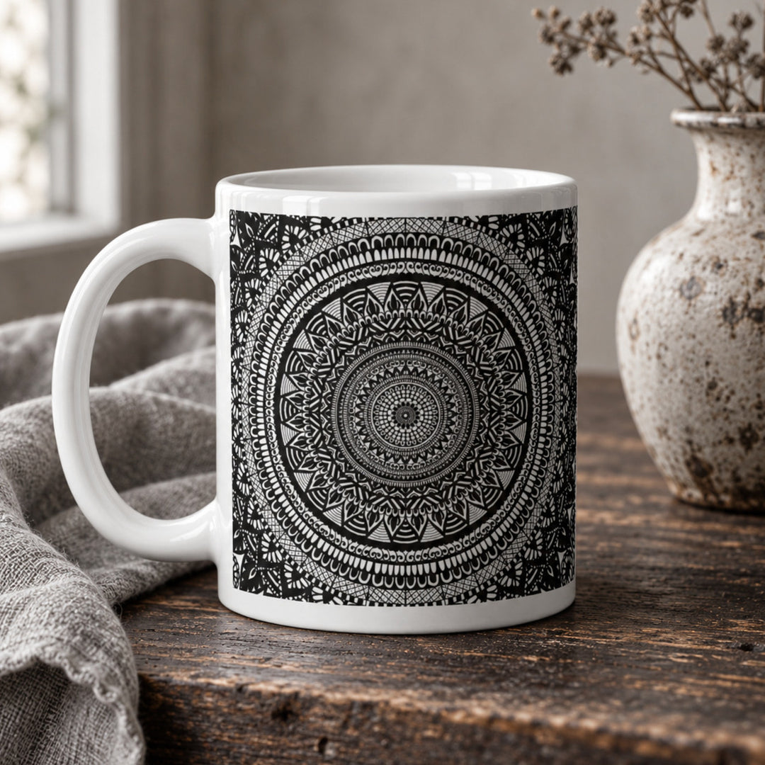 Close-up of black and white mandala mug in a rustic boho setting