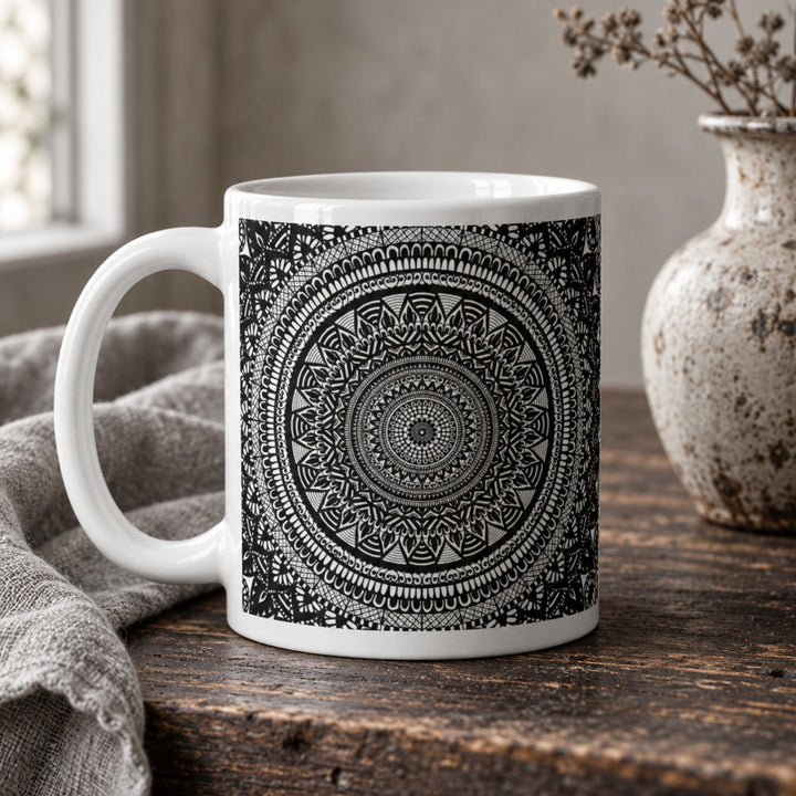 Close-up of black and white mandala mug in a rustic boho setting