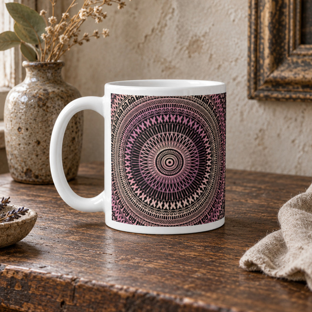 Close-up of blush pink and beige mandala mug in a rustic boho setting