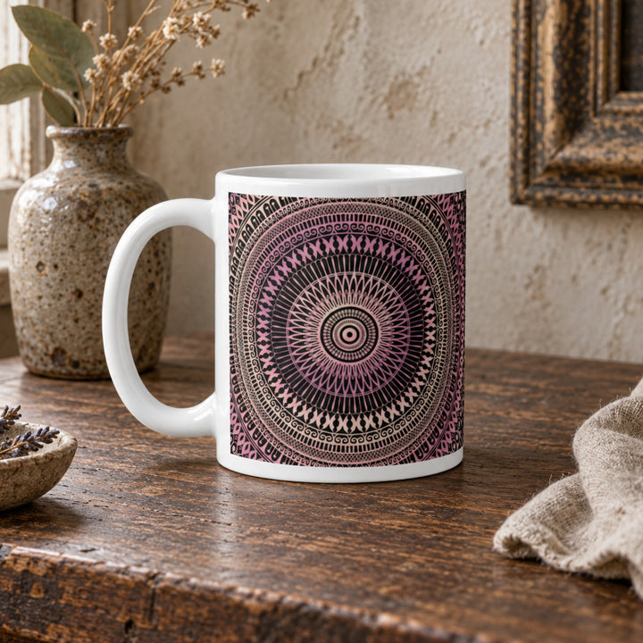 Close-up of blush pink and beige mandala mug in a rustic boho setting