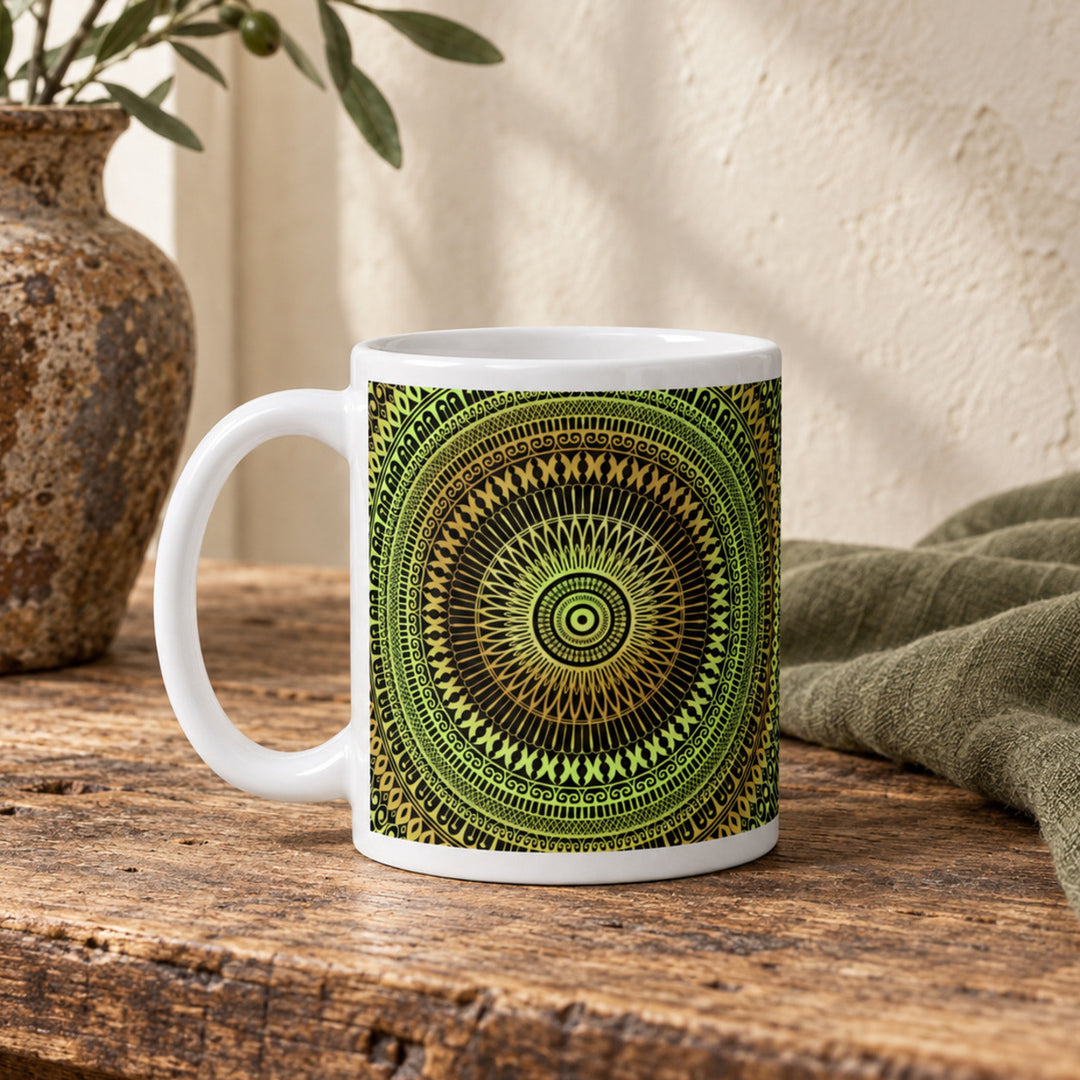 Close-up of soft green and ochre mandala mug in a rustic boho setting