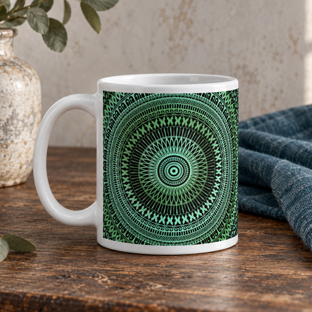 Close-up of blue green decorative mandala mug in a rustic boho setting